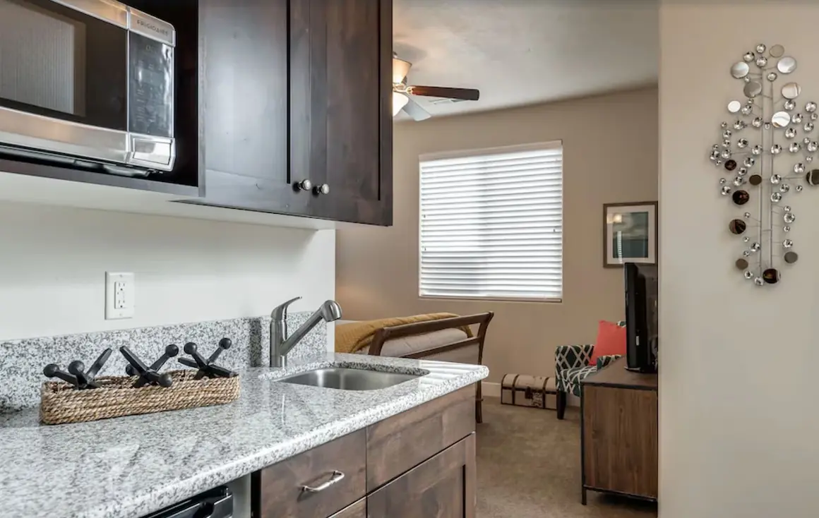 Casita kitchenette with microwave, small sink and cabinets