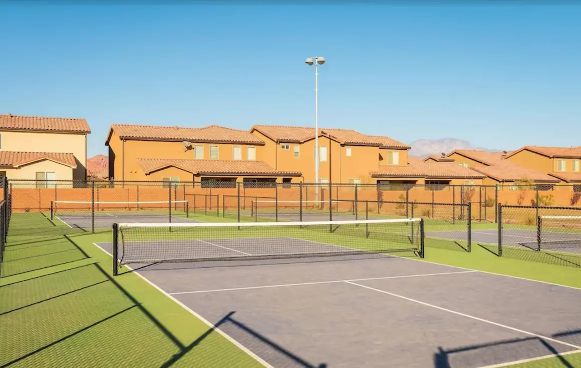Pickleball courts with homes behind